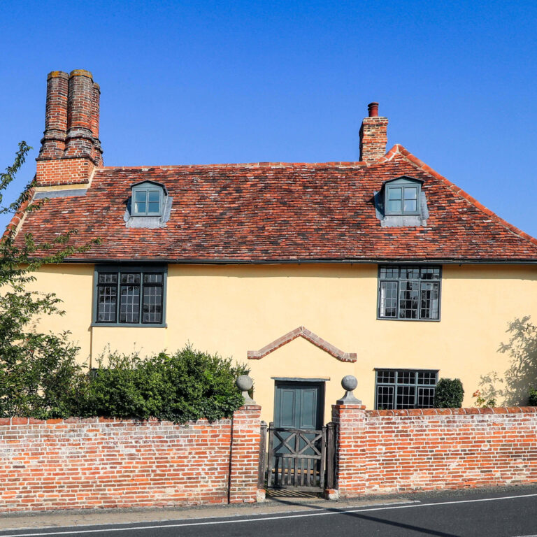 Cottage in Honeycomb with brick wall.