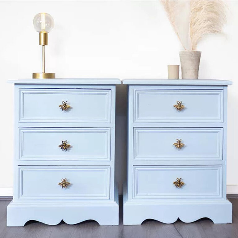 Wooden draws painted in Bo Peep with a lamp and feather vase as décor.