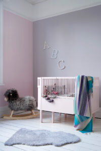 Nursery .ft wall in Eiderdown and Rosie Posie, cot in Cupcake
