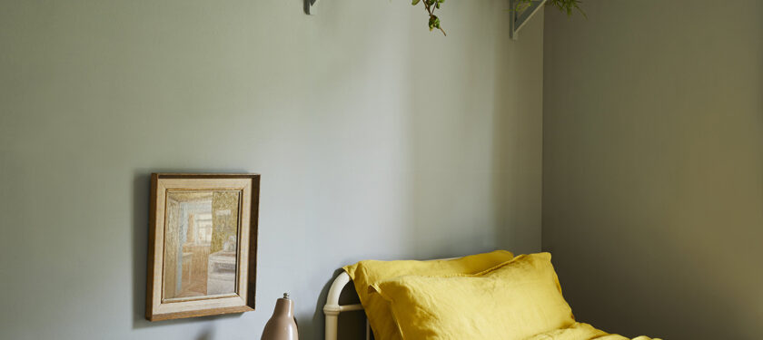 A bedroom painted in Grassy Claypaint.