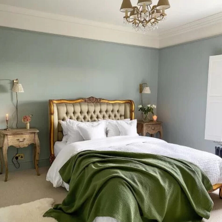 A bedroom display with a chandelier light.