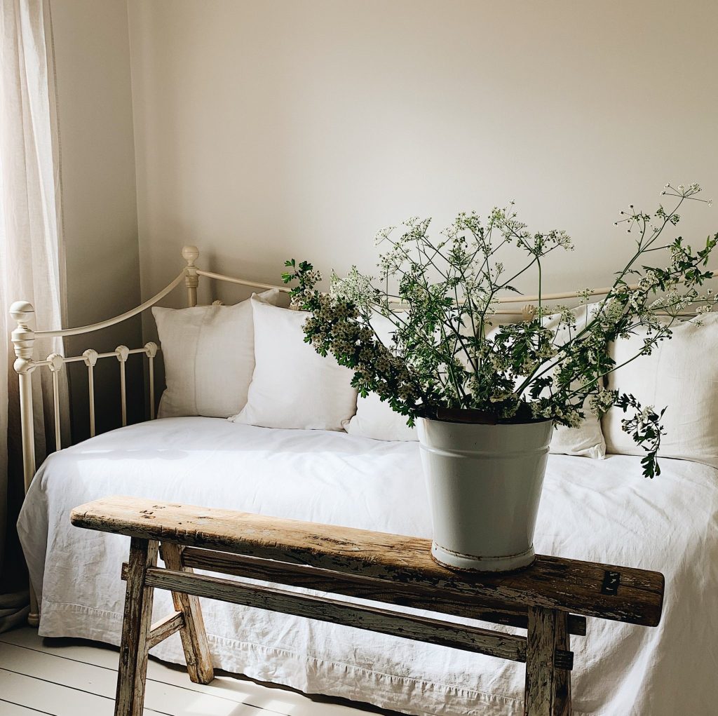Warm neutral paint colour Tom's Bakery in Claypaint helps to create a calm backdrop to this bedroom