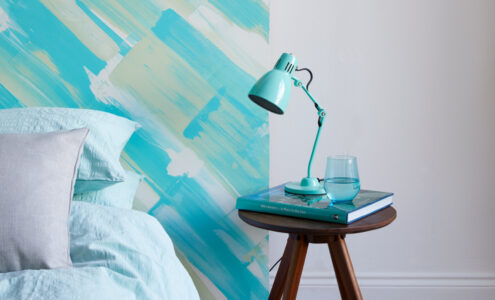 Coastal interiors bedroom design idea, a painted headboard
