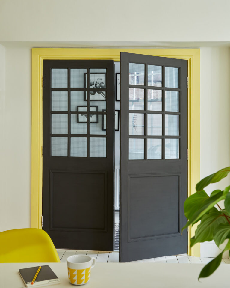 Daisychain trim around bold black doors.