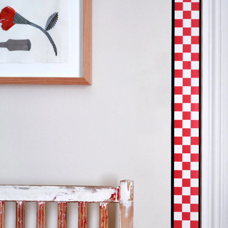 A bold red and white checked boarder on a wall.