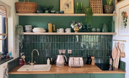 White and green kitchen nook with a sink and storage.