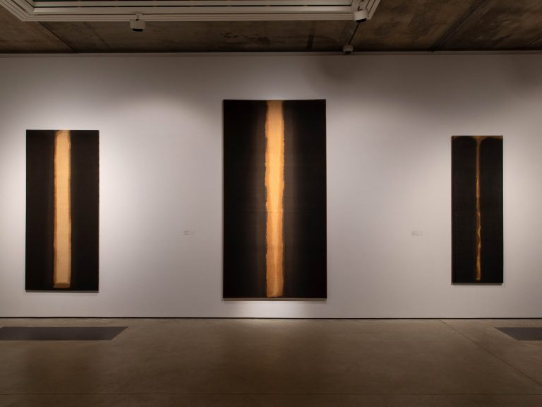 3 hanging paintings of the artist Yun Hyong-Keun on exhibit.